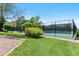 Community tennis courts feature green space with black fence enclosure at 7659 S Rosemary Cir, Englewood, CO 80112