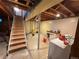 Unfinished basement with stairs ready for customization and expansion at 8995 E Cornell Ave, Denver, CO 80231