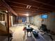 Unfinished basement showcasing potential with exposed ceiling, concrete walls, and ample space for customization at 8995 E Cornell Ave, Denver, CO 80231