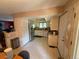 Functional kitchen features white cabinetry, stainless steel refrigerator, and bright natural light at 8995 E Cornell Ave, Denver, CO 80231