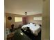 Spacious bedroom features natural light, comfortable bed and decor at 8995 E Cornell Ave, Denver, CO 80231