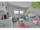 Playroom/bedroom featuring toys, bright decor, and ample sunlight at 23601 E Mississippi Cir, Aurora, CO 80018