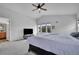 Bright bedroom with large windows, vaulted ceilings, and a conveniently located ensuite bathroom at 23601 E Mississippi Cir, Aurora, CO 80018