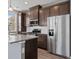 Bright kitchen showcasing stainless steel appliances and counter tops at 23744 E Ida Pl # E, Aurora, CO 80016