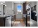 Modern kitchen with stainless steel appliances and wood cabinets at 23744 E Ida Pl # E, Aurora, CO 80016