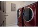 Contemporary laundry room features a front load washer/dryer set with sleek design and clean, neutral walls at 23744 E Ida Pl # E, Aurora, CO 80016