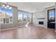 Spacious living room with fireplace and large windows at 23744 E Ida Pl # E, Aurora, CO 80016