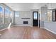Open living room with fireplace and bright windows at 23744 E Ida Pl # E, Aurora, CO 80016