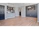 Modern living room features wood floors and a decorative wall at 23744 E Ida Pl # E, Aurora, CO 80016