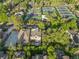 Aerial view of property close to community tennis courts surrounded by lush greenery at 445 Forest St, Denver, CO 80220