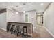Basement wet bar with a white counter and black bar stools at 445 Forest St, Denver, CO 80220