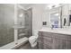 Contemporary bathroom featuring a glass walk-in shower, vanity, and ample lighting at 445 Forest St, Denver, CO 80220