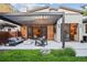 Outdoor patio with a modern pergola, comfortable seating, and a stylish fire pit at 445 Forest St, Denver, CO 80220