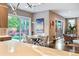 Open dining area provides seamless indoor-outdoor living with backyard views and easy access to kitchen at 445 Forest St, Denver, CO 80220