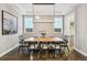 Elegant dining room featuring modern chandelier, tray ceilings, and large windows at 445 Forest St, Denver, CO 80220