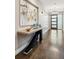Entry hallway with modern table decor, elegant artwork, and contemporary lighting fixture at 445 Forest St, Denver, CO 80220