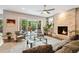 Comfortable living room with a stone fireplace, plush seating, large sliding doors, and a view of the backyard at 445 Forest St, Denver, CO 80220