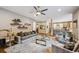 Open concept living room with hardwood floors, neutral tones, and seamless flow into the modern kitchen at 445 Forest St, Denver, CO 80220