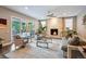 Inviting living room with stone fireplace, plush seating, hardwood floors, and sliding doors to the patio at 445 Forest St, Denver, CO 80220