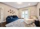Cozy living room with large rug, comfortable seating, and French doors to the outside at 445 Forest St, Denver, CO 80220