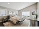Serene main bedroom boasts a pitched ceiling, multiple windows, and a cozy seating area at 445 Forest St, Denver, CO 80220