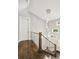Staircase with modern lighting and metal wire banister at 445 Forest St, Denver, CO 80220