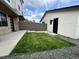 Nicely maintained backyard featuring a small lawn area, gravel landscaping, and concrete pavers for a modern look at 960 Quitman St, Denver, CO 80204