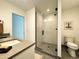 Contemporary bathroom showcasing a glass-enclosed shower, a toilet, and modern finishes, and a neutral color scheme at 960 Quitman St, Denver, CO 80204