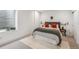 Comfortable bedroom with a large window for natural light and a neutral color palette for relaxation at 960 Quitman St, Denver, CO 80204