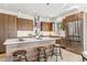 Open kitchen with a center island, pendant lighting, stainless steel appliances, and lots of cabinet space at 960 Quitman St, Denver, CO 80204