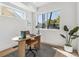 Bright home office with large window, modern desk, and hardwood floors. Perfect for remote work at 960 Quitman St, Denver, CO 80204
