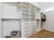 Spacious walk-in closet with custom shelving and drawers, providing ample storage space at 960 Quitman St, Denver, CO 80204