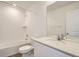 Bathroom featuring a tub, white cabinets and tile flooring at 15228 Detroit St, Thornton, CO 80602