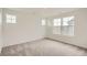 Neutral bedroom with natural light and plush carpet flooring at 15228 Detroit St, Thornton, CO 80602