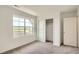 Bedroom with a closet, carpeting and lots of natural light from large windows at 15228 Detroit St, Thornton, CO 80602