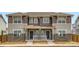 Charming two-story townhome with stone accents and covered front porch at 15228 Detroit St, Thornton, CO 80602