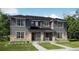 Charming townhome with stone accents, a well-manicured lawn, and inviting covered front porches at 15228 Detroit St, Thornton, CO 80602