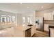 Bright, open-concept kitchen with stainless steel appliances and large island at 15228 Detroit St, Thornton, CO 80602