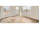 Bright living room with hardwood floors and lots of natural light from windows at 15228 Detroit St, Thornton, CO 80602