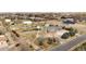 Aerial view of a home with expansive lot, showcasing landscaping, driveway, and detached garages at 23753 E 155Th Way, Brighton, CO 80603