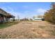 Home backyard with home and detached building at 23753 E 155Th Way, Brighton, CO 80603