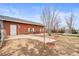 Brick home exterior with patio, featuring a well-maintained lawn and easy access at 23753 E 155Th Way, Brighton, CO 80603