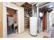 Unfinished basement with water heater, sink, and exposed utilities at 23753 E 155Th Way, Brighton, CO 80603