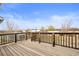 Expansive wooden deck with railing, offering outdoor living space and scenic views at 23753 E 155Th Way, Brighton, CO 80603
