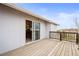 Charming wooden deck with access to the house through sliding doors and scenic outdoor views at 23753 E 155Th Way, Brighton, CO 80603
