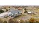 Aerial view of a house featuring a deck and well-maintained yard, offering a serene outdoor space at 23753 E 155Th Way, Brighton, CO 80603