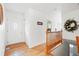 Inviting foyer with hardwood floors, a decorative wreath, and a charming front door at 23753 E 155Th Way, Brighton, CO 80603