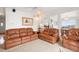 Inviting living room with comfortable seating, a ceiling fan, and an open view to the dining and kitchen areas at 23753 E 155Th Way, Brighton, CO 80603