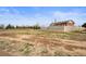 Large open yard surrounding a lovely brick home, offering plenty of space for outdoor activities at 23753 E 155Th Way, Brighton, CO 80603
