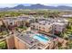Aerial view featuring a rooftop pool and hot tub with scenic mountain views at 3701 Arapahoe Ave # 304, Boulder, CO 80303